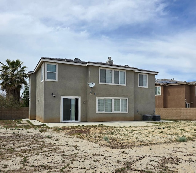 39294 Butler St, Palmdale, CA 93551 - rear view of property featuring stucco siding and a chimney