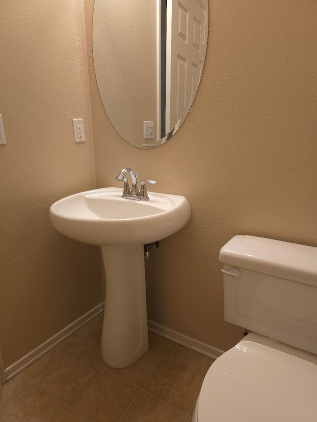 39294 Butler St, Palmdale, CA 93551 - bathroom featuring toilet, tile patterned floors, and baseboards