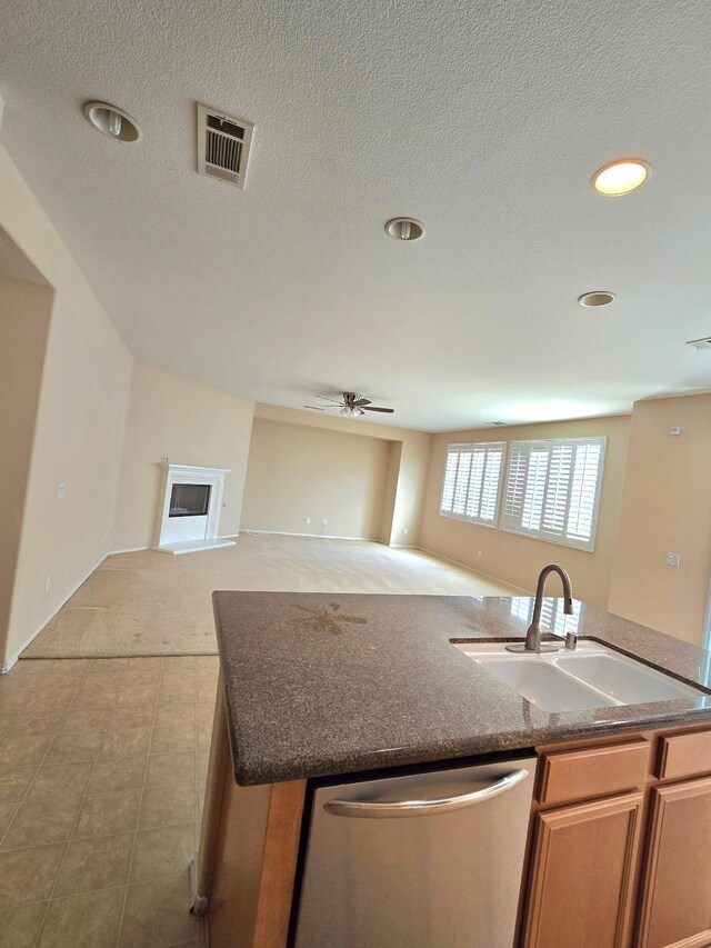 39294 Butler St, Palmdale, CA 93551 - kitchen with dishwasher, a sink, an island with sink, open floor plan, and a ceiling fan