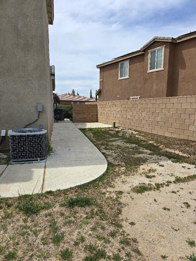 39294 Butler St, Palmdale, CA 93551 - view of yard with cooling unit and a patio area