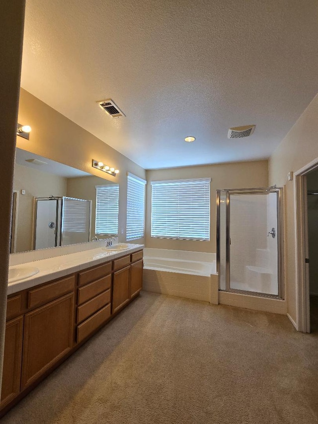 39294 Butler St, Palmdale, CA 93551 - bathroom featuring a stall shower, carpet, double vanity, a bath, and a textured ceiling