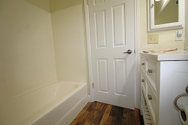 bathroom with vanity and wood finished floors
