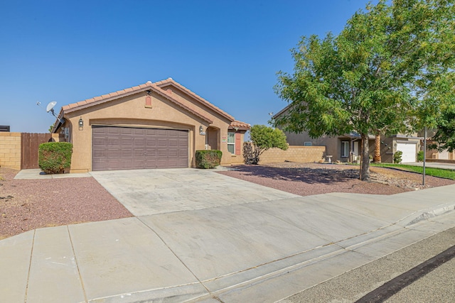 ranch-style house featuring a garage