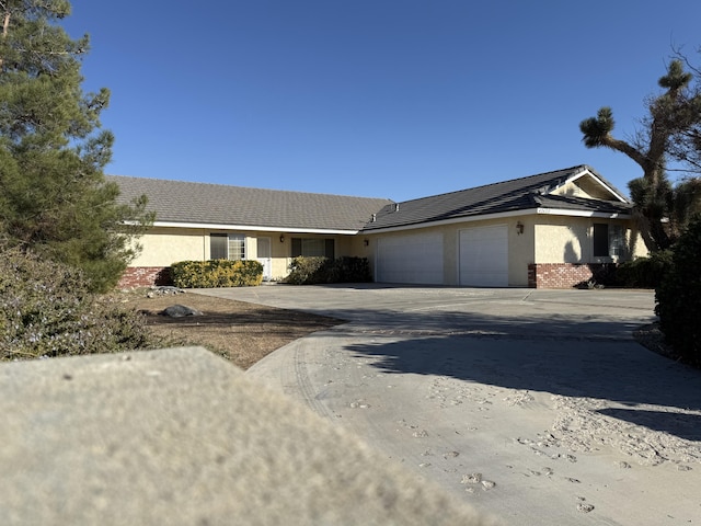 single story home featuring a garage