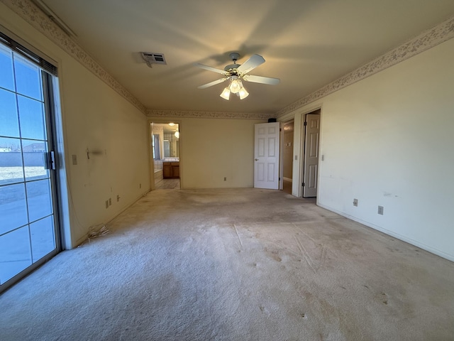 unfurnished room featuring light carpet and ceiling fan