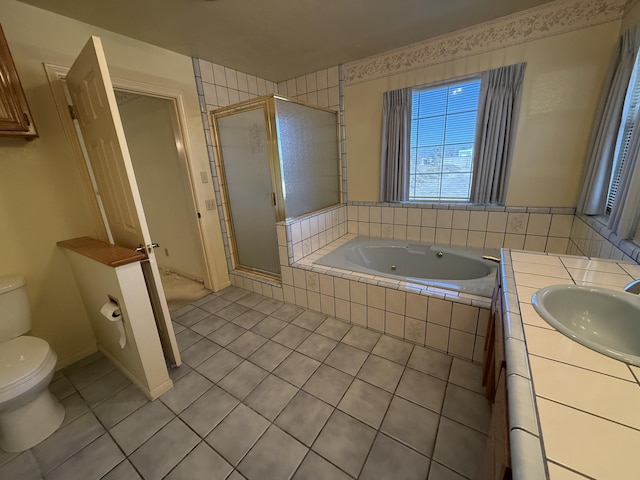 full bathroom featuring tile patterned flooring, vanity, independent shower and bath, and toilet