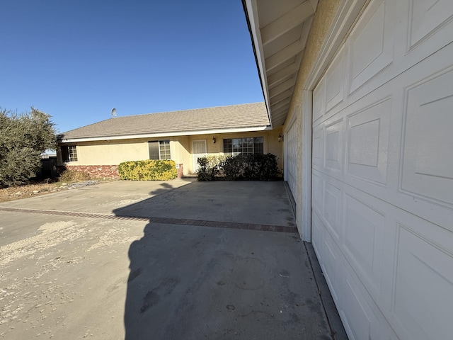 view of side of property with a garage