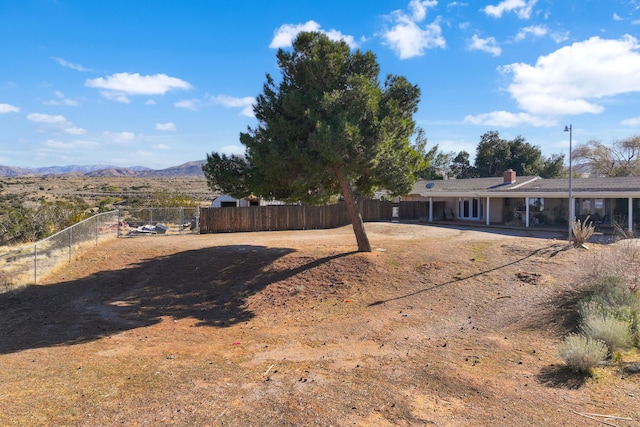 36042 E 32nd St, Palmdale, CA 93550 - view of yard featuring a mountain view and a patio area