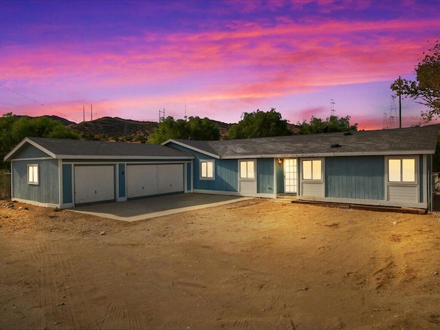 ranch-style home with a garage