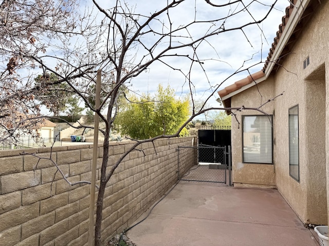 exterior space featuring a gate and fence