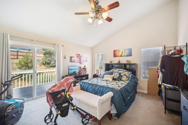 bedroom featuring ceiling fan, access to exterior, light colored carpet, and vaulted ceiling