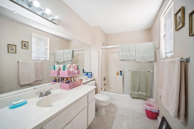 full bath with toilet, tile patterned flooring, vanity, and enclosed tub / shower combo