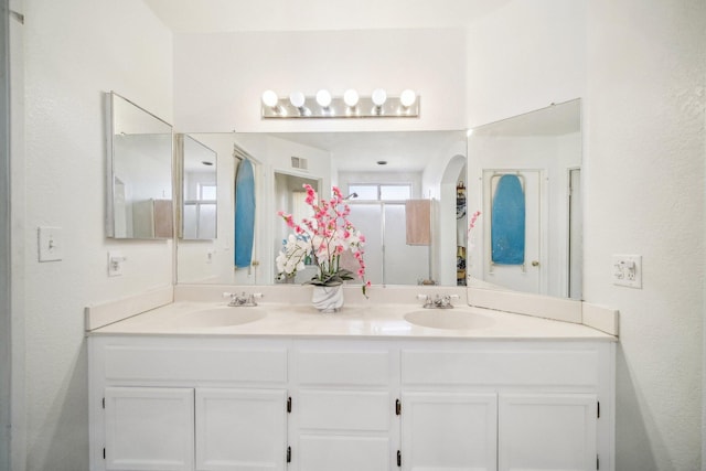 bathroom with double vanity and a sink