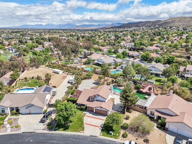 birds eye view of property featuring a mountain view and a residential view