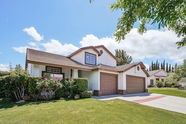 traditional-style house featuring a garage, a front lawn, stucco siding, and concrete driveway