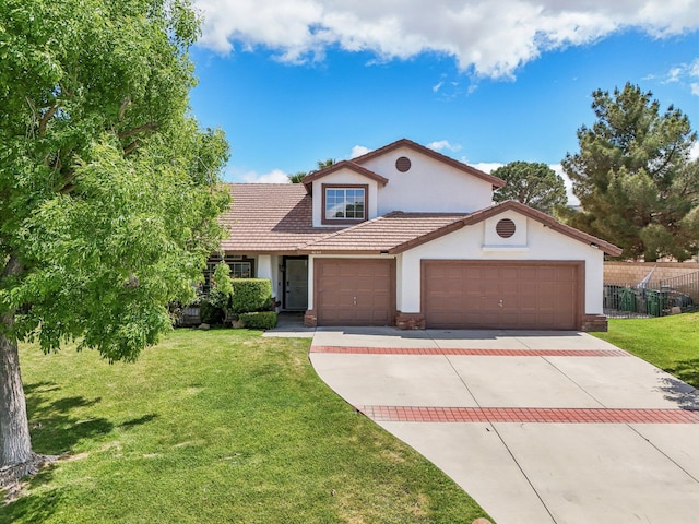 mediterranean / spanish-style house with a tiled roof, a front yard, fence, concrete driveway, and stucco siding