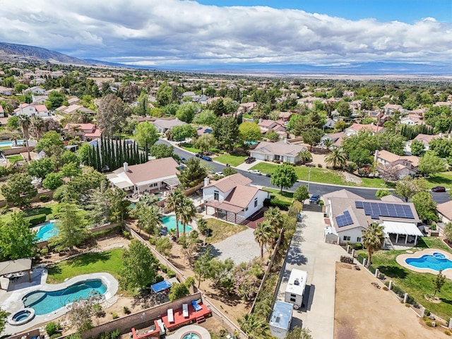birds eye view of property with a residential view