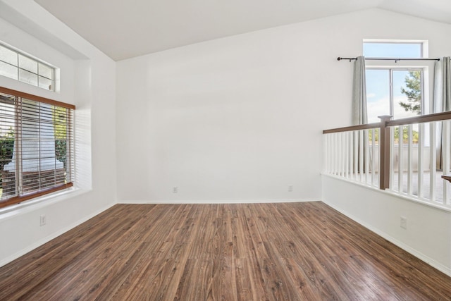 unfurnished room featuring baseboards, wood finished floors, and a healthy amount of sunlight