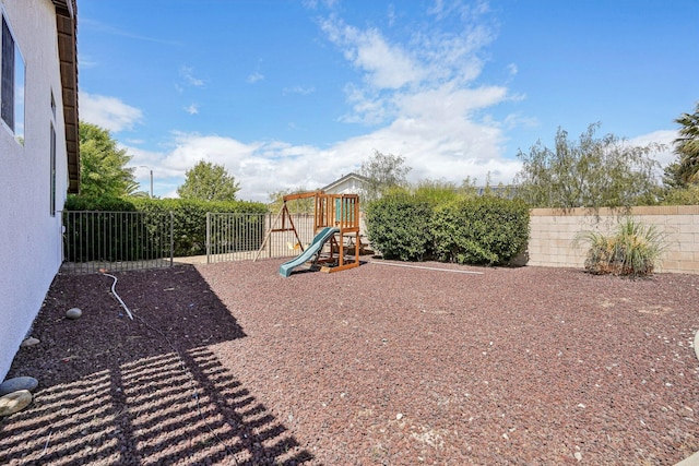 view of jungle gym with a fenced backyard