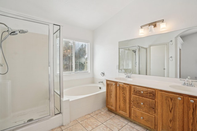 bathroom with a sink, tile patterned floors, a shower stall, and a bath