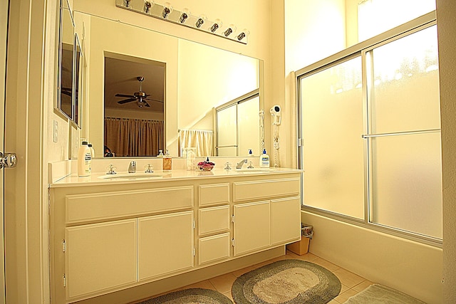 2749 W Lingard St, Lancaster, CA 93536 - bathroom with bath / shower combo with glass door, a ceiling fan, tile patterned flooring, and a sink
