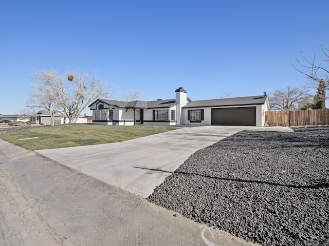 single story home featuring a front yard and a garage