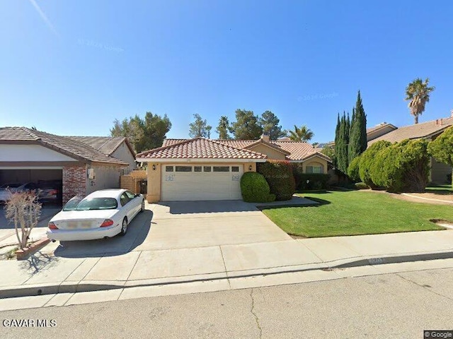 3202 Angeleno Pl, Palmdale, CA 93551 - view of front of house featuring a tile roof, a garage, a front yard, driveway, and stucco siding