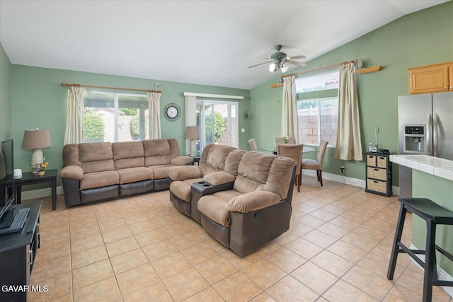 36525 Summerholly Cir, Palmdale, CA 93550 - living area with lofted ceiling, light tile patterned flooring, and a ceiling fan