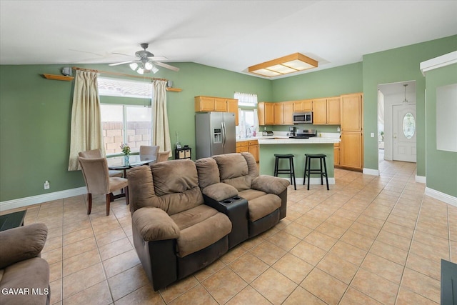 36525 Summerholly Cir, Palmdale, CA 93550 - living area with light tile patterned floors, vaulted ceiling, and a ceiling fan