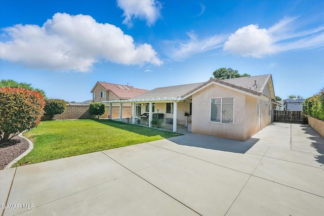 36525 Summerholly Cir, Palmdale, CA 93550 - rear view of house featuring a patio, concrete driveway, a fenced backyard, and a tile roof