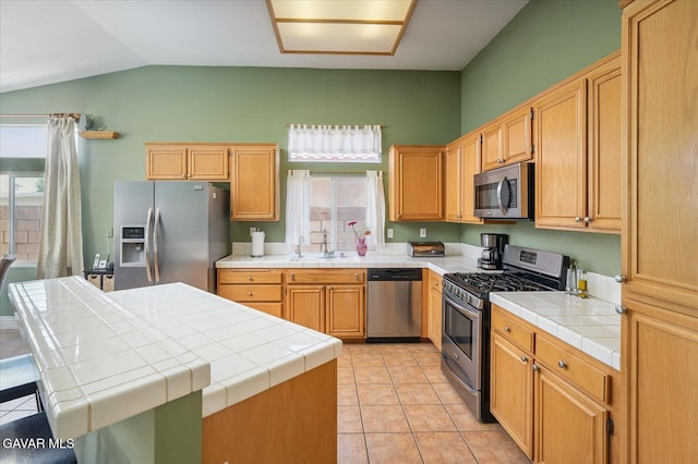 36525 Summerholly Cir, Palmdale, CA 93550 - kitchen with stainless steel appliances, vaulted ceiling, tile countertops, light tile patterned floors, and a kitchen island