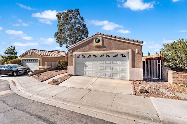 ranch-style home featuring a garage