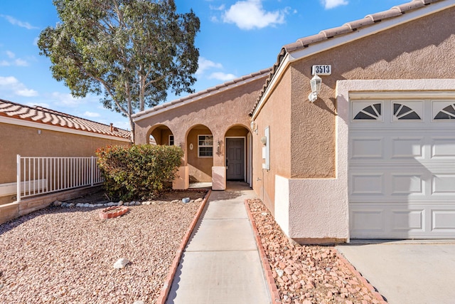 view of front of property with a garage