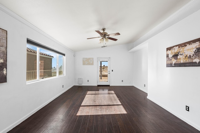 spare room featuring ceiling fan, dark hardwood / wood-style flooring, and vaulted ceiling