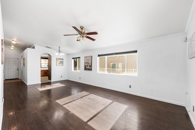 unfurnished living room featuring ceiling fan, dark hardwood / wood-style flooring, crown molding, and a healthy amount of sunlight