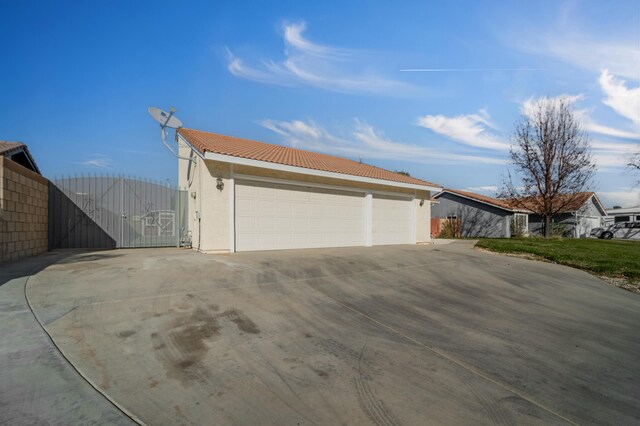 view of side of home with a garage