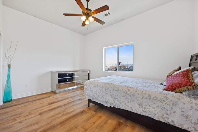 bedroom featuring hardwood / wood-style flooring and ceiling fan