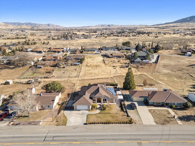 birds eye view of property with a mountain view