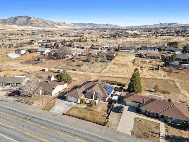 birds eye view of property featuring a mountain view