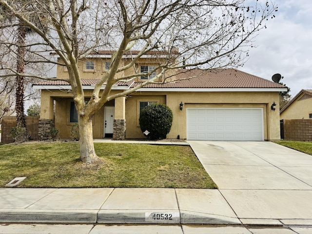 view of front of home with concrete driveway, a tiled roof, fence, a front lawn, and stucco siding