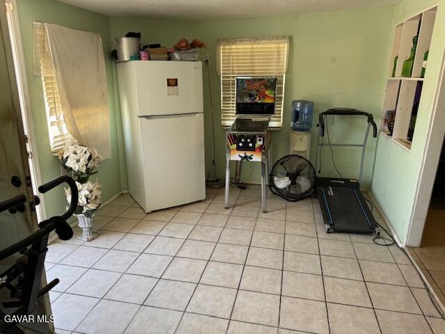 45529 Sancroft Ave, Lancaster, CA 93535 - kitchen featuring freestanding refrigerator and light tile patterned floors