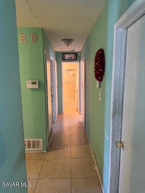 45529 Sancroft Ave, Lancaster, CA 93535 - corridor with tile patterned floors and baseboards