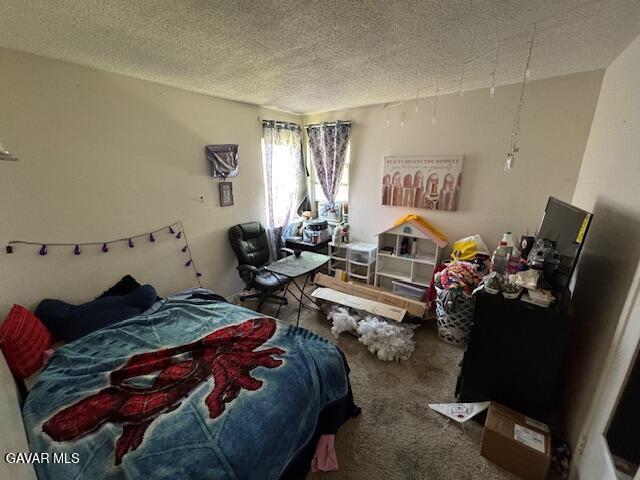 45529 Sancroft Ave, Lancaster, CA 93535 - carpeted bedroom featuring a textured ceiling