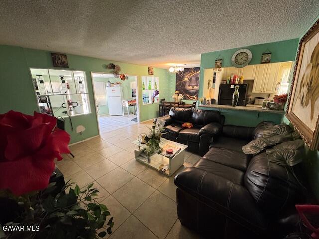 45529 Sancroft Ave, Lancaster, CA 93535 - living area with a textured ceiling and tile patterned floors