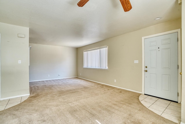 43441 W 30th St Unit 4, Lancaster, CA 93536 - unfurnished living room with a ceiling fan, carpet flooring, and tile patterned flooring