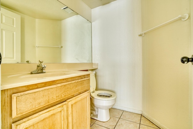 43441 W 30th St Unit 4, Lancaster, CA 93536 - bathroom with tile patterned floors, toilet, vanity, and baseboards