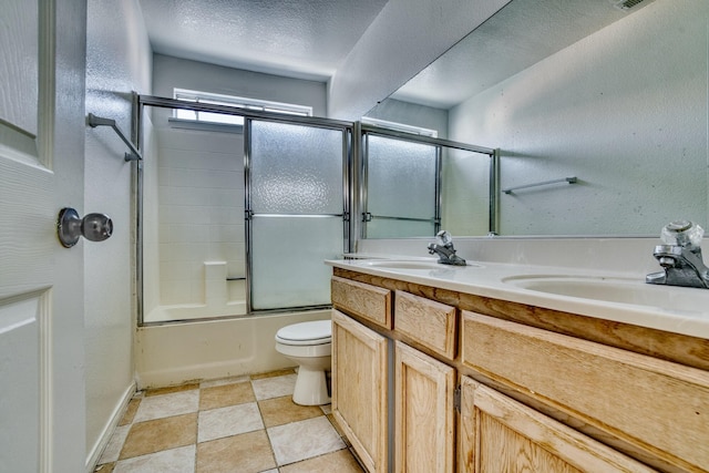 43441 W 30th St Unit 4, Lancaster, CA 93536 - full bath featuring toilet, double vanity, combined bath / shower with glass door, and a textured ceiling