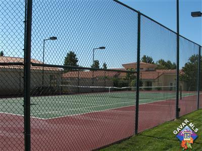 view of tennis court featuring fence