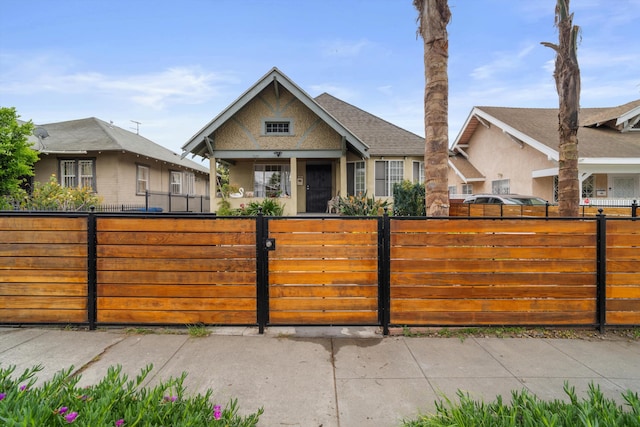 1320 W 50th St, Los Angeles, CA 90037 - view of front of home with a fenced front yard and stucco siding