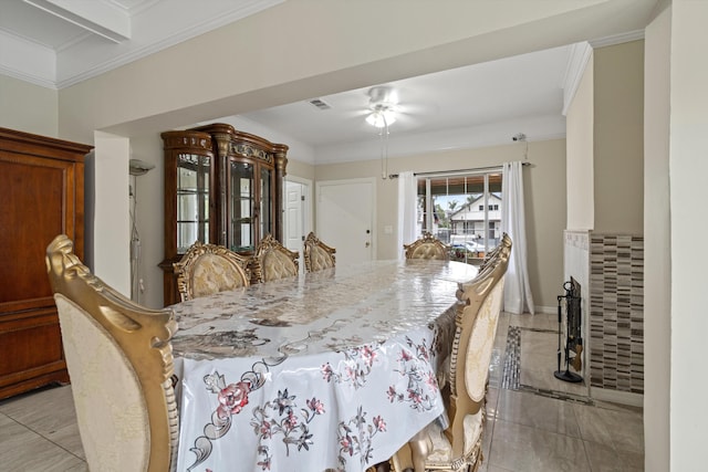 1320 W 50th St, Los Angeles, CA 90037 - dining area featuring light tile patterned floors, a ceiling fan, crown molding, visible vents, and baseboards